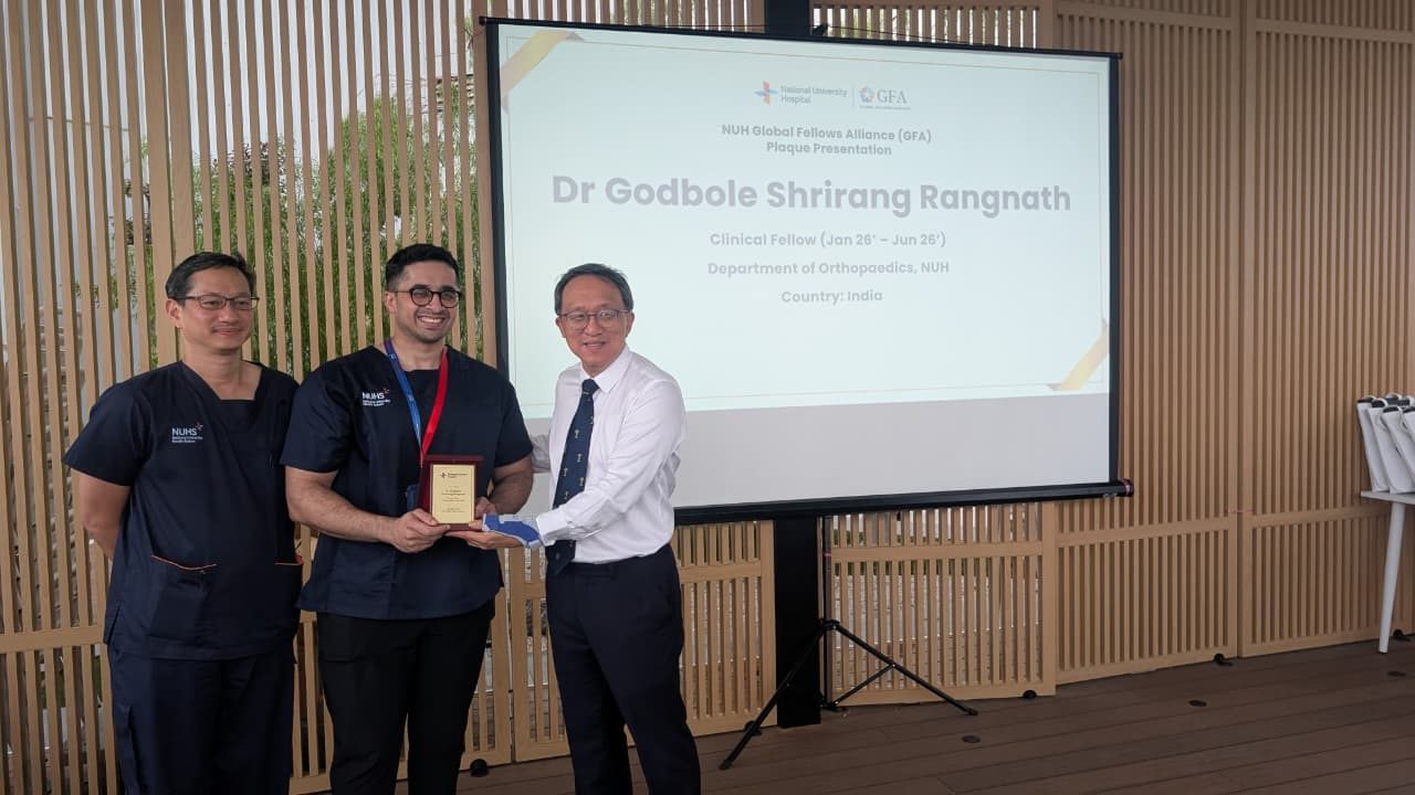 Dr. Godbole's induction into the NUH Global Fellows Alliance with Dr. Mark Puhaindran and Dr. James Hui