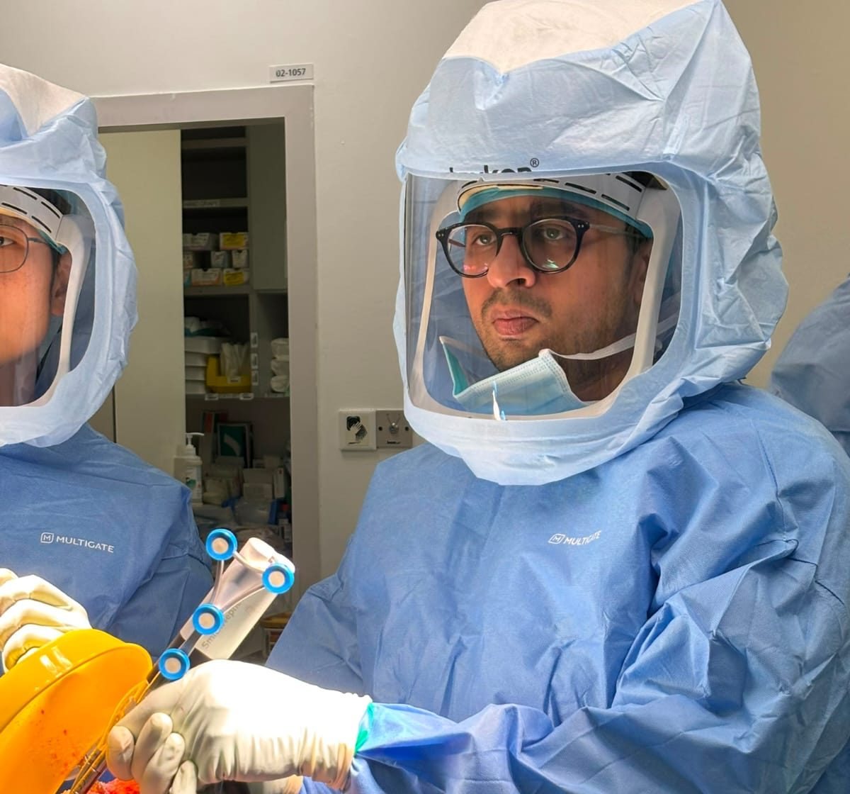 Dr. Godbole operating the CORI robotic system in surgery